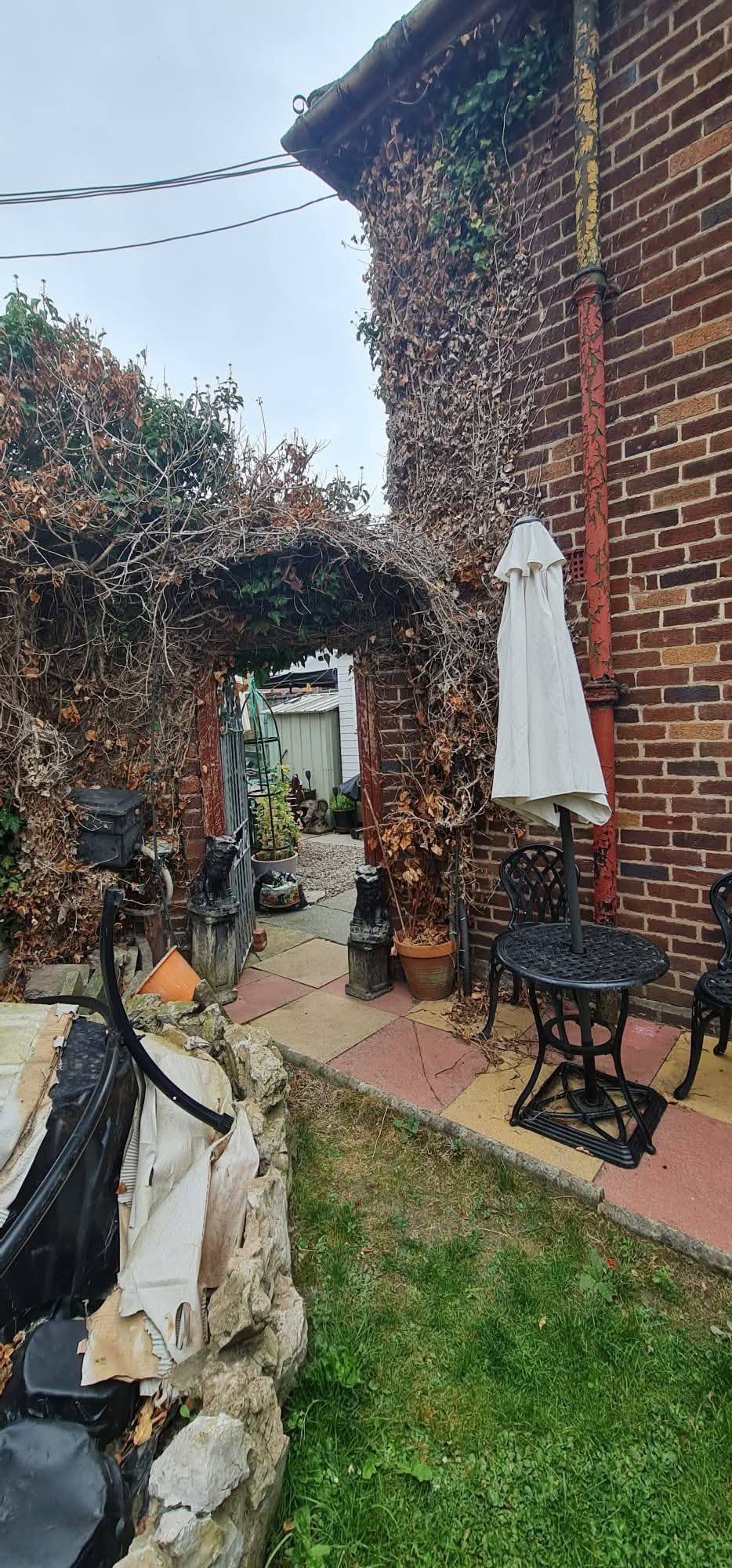 Removing branches on a house in Birkenhead